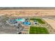 New construction community featuring a resort-style pool, clubhouse, playground, and open green space at 2475 W Spaulding Ave, Apache Junction, AZ 85120
