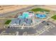 Community center aerial view featuring the pool, playground, clubhouse and ample parking for residents at 2475 W Spaulding Ave, Apache Junction, AZ 85120