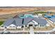 Exterior elevation of a community center showing the entrance, architectural details, and parking area at 2475 W Spaulding Ave, Apache Junction, AZ 85120