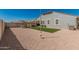 Spacious backyard featuring gravel, a small area of artificial turf, and an outdoor seating area at 2475 W Spaulding Ave, Apache Junction, AZ 85120