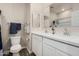 Bright bathroom featuring dual sinks with white countertops and modern fixtures, with plenty of storage at 2475 W Spaulding Ave, Apache Junction, AZ 85120