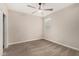 Neutral bedroom with plush carpet, a ceiling fan, and a large window at 2475 W Spaulding Ave, Apache Junction, AZ 85120