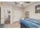 Bright bedroom featuring a ceiling fan and functional workspace for relaxing retreat at 2475 W Spaulding Ave, Apache Junction, AZ 85120