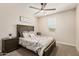 Comfortable bedroom featuring a ceiling fan and plush bedding, creating a relaxing retreat at 2475 W Spaulding Ave, Apache Junction, AZ 85120