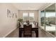 Dining room with long table, seating for ten, and sliding glass doors to the backyard at 2475 W Spaulding Ave, Apache Junction, AZ 85120