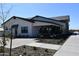 Beautiful single-story home with a modern design, dark roof accents, and a well-manicured lawn at 2475 W Spaulding Ave, Apache Junction, AZ 85120