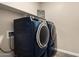 Laundry room featuring stacked washer and dryer units for space-saving convenience at 2475 W Spaulding Ave, Apache Junction, AZ 85120