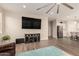 Bright living room features a large flat screen television and opens to the kitchen at 2475 W Spaulding Ave, Apache Junction, AZ 85120