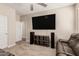 Spacious living room features a large television, built-in speakers and comfortable seating at 2475 W Spaulding Ave, Apache Junction, AZ 85120