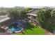 Aerial view of a stunning backyard with a pool, outdoor seating, and a manicured lawn; perfect for outdoor living at 25767 N 67Th Dr, Peoria, AZ 85383