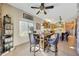 Dining area features tile flooring, stylish stools, and a view into the kitchen at 25767 N 67Th Dr, Peoria, AZ 85383