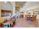 Open dining room with large tile flooring, decorative chandelier, and beautiful furnishings at 25767 N 67Th Dr, Peoria, AZ 85383