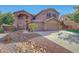 Spacious two-story home with a three car garage, landscaped yard and American flag at 25767 N 67Th Dr, Peoria, AZ 85383