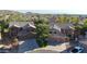 Aerial view of two homes with well-manicured yards in a residential neighborhood with mountain views at 25767 N 67Th Dr, Peoria, AZ 85383