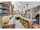 Spacious kitchen featuring a large granite island and custom cabinets with stainless appliances at 25767 N 67Th Dr, Peoria, AZ 85383