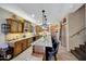 Spacious kitchen featuring a large granite island and custom cabinets with stainless appliances at 25767 N 67Th Dr, Peoria, AZ 85383