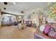 Spacious living room featuring a stone accent wall and comfortable seating at 25767 N 67Th Dr, Peoria, AZ 85383