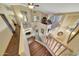 Staircase leading to an upper-level loft area with game room and vaulted ceilings at 25767 N 67Th Dr, Peoria, AZ 85383