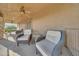 Covered patio with stylish outdoor furniture and a ceiling fan for comfortable outdoor living at 25767 N 67Th Dr, Peoria, AZ 85383