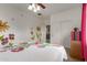 Bedroom with a white floral comforter, decorative wall paintings and a closet at 27071 N 172Nd Ln, Surprise, AZ 85387