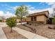 Charming two-story home with decorative stone accents and a low-maintenance landscaped front yard at 27071 N 172Nd Ln, Surprise, AZ 85387