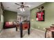Spacious game room with a foosball table, sports decor, and a comfortable couch at 27071 N 172Nd Ln, Surprise, AZ 85387