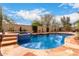 Sparkling pool featuring a spa and desert landscaping at 27071 N 172Nd Ln, Surprise, AZ 85387