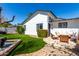 Backyard featuring a lush green lawn, fountain and patio furniture at 2717 E Aster Dr, Phoenix, AZ 85032