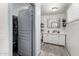 Bright bathroom with a double sink vanity, storage and closet at 2717 E Aster Dr, Phoenix, AZ 85032