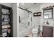 Updated bathroom with a glass shower and custom shelving at 2717 E Aster Dr, Phoenix, AZ 85032