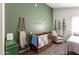 bedroom featuring forest decals, wood flooring, and crib at 2717 E Aster Dr, Phoenix, AZ 85032