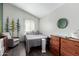 Cozy bedroom design, natural lighting, and wood-look flooring at 2717 E Aster Dr, Phoenix, AZ 85032