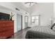 Bedroom with plank floors, vaulted ceiling, dresser and natural light at 2717 E Aster Dr, Phoenix, AZ 85032
