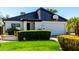 Beautiful exterior featuring a lush green lawn, desert landscaping, and a well-maintained two-car garage at 2717 E Aster Dr, Phoenix, AZ 85032