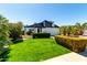 Beautifully landscaped front yard with green grass and desert accents leading up to a well-maintained home exterior at 2717 E Aster Dr, Phoenix, AZ 85032