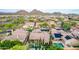 Expansive aerial view of a Primary-planned community showcasing pools, landscaping, and nearby mountains at 28834 N 68Th Ave, Peoria, AZ 85383