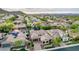 Expansive aerial view of a neighborhood featuring desert landscape and luxurious homes with solar panels at 28834 N 68Th Ave, Peoria, AZ 85383