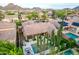 Spacious backyard haven with pool, fire pit, lush landscape, and BBQ, seen from an impressive aerial view at 28834 N 68Th Ave, Peoria, AZ 85383