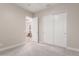 Bedroom with carpet flooring, neutral paint, closet, and bright natural light at 28834 N 68Th Ave, Peoria, AZ 85383