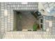 Intimate aerial view of a courtyard showcasing brickwork, potted plants, and a welcoming entrance at 28834 N 68Th Ave, Peoria, AZ 85383