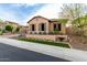 Charming single-story home featuring desert landscaping, shutters, and neutral earth-tone paint at 28834 N 68Th Ave, Peoria, AZ 85383