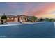 Street view of a single-Gathering home at sunset with manicured desert landscaping and a brick paved driveway at 28834 N 68Th Ave, Peoria, AZ 85383