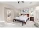 Spacious main bedroom featuring a king-size bed, plush carpeting, and neutral decor at 28834 N 68Th Ave, Peoria, AZ 85383