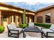 Inviting outdoor patio with stylish seating and lush, well-maintained landscaping at 28834 N 68Th Ave, Peoria, AZ 85383