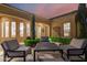 Charming outdoor patio with comfortable seating, manicured landscaping, and elegant architecture at 28834 N 68Th Ave, Peoria, AZ 85383
