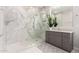 Luxurious bathroom with a glass-enclosed shower, stylish tiles, and modern fixtures at 28834 N 68Th Ave, Peoria, AZ 85383