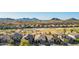 Beautiful aerial view of the community showing mountain views, desert landscaping, and community green spaces at 29794 N Little Leaf Dr, San Tan Valley, AZ 85143