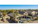 A private fenced backyard with a manicured lawn and a covered patio area at 29794 N Little Leaf Dr, San Tan Valley, AZ 85143