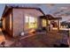 Exterior view of the house featuring a cozy patio with an outdoor kitchen and landscaped backyard at 29794 N Little Leaf Dr, San Tan Valley, AZ 85143