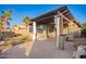 Backyard with a covered patio, outdoor seating, lush greenery and an outdoor hot tub at 29794 N Little Leaf Dr, San Tan Valley, AZ 85143